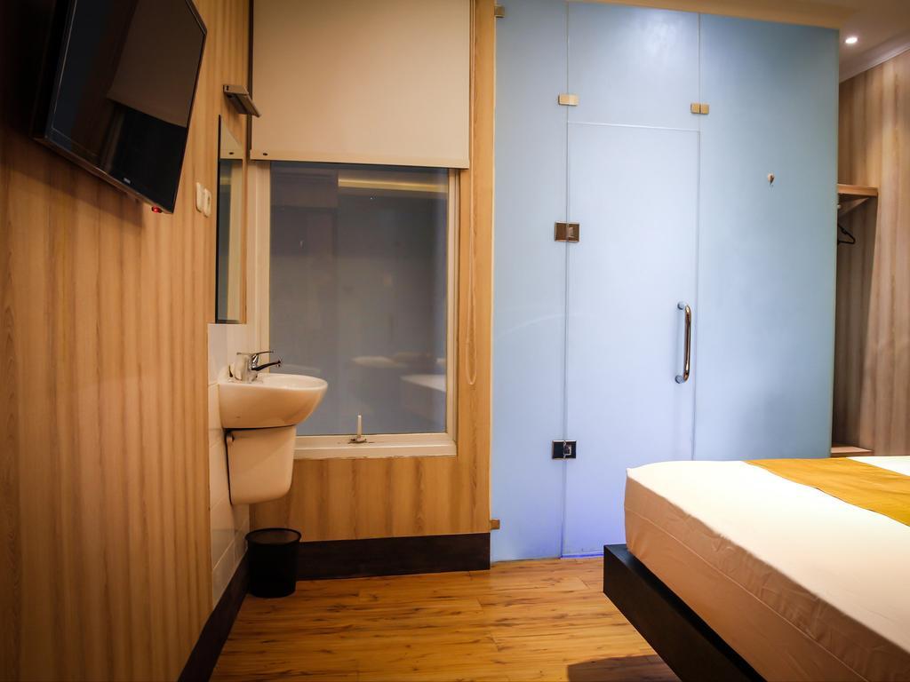 Madu Inn Jakarta Szoba fotó